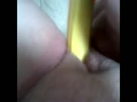 Desperate married woman plunges fresh banana in and out of her cunt in this insertion video